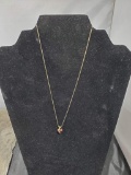 14K GE charm, unmarked necklace included, stand not included