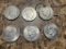 6- Eisenhower Dollar Coins, one is on a necklace