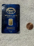 1 gram .9999 fine gold bar on holder