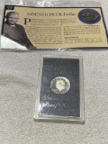 1972 Proof Eisenhower Dollar and additional 74 Ike, with informational placard