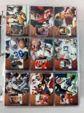 4 football sets in a binder: '93 SkyBox (2), Score Select, Impact,