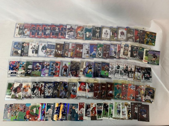 Lot of 100 Serial #'D Football cards including Faulk, Vick, Singletary, Woodson, Etc.