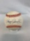Roger Clemons Sr. signed baseball in a display case