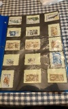 BINDER WITH 165 POSTAGE STAMPS COLLECTION