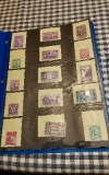 BINDER WITH 90 POSTAGE STAMPS COLLECTION