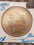 1885O MORGAN DOLLAR BU TONING