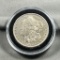 1878-S Morgan Silver Dollar in coin capsule