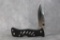 Al Mar,  black Zytel open scales,lock back 110/200 1st prod