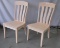 Two unfinished red oak chairs