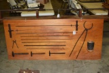 Board with barrel making tools.