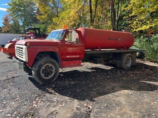1976 F7000 flatbed truck with 1,500 ga water tank showing 36,786 miles