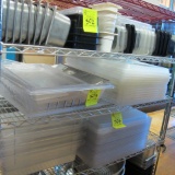contents of shelf- plastic containers & lids