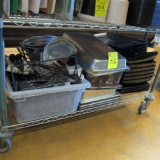 contents of shelf- stainless pans, deli trays, hand utensils, stainless bowls