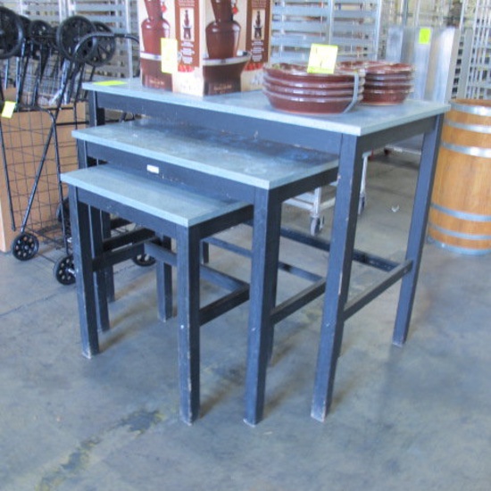 black wooden merchandising tables w/ galvanized tops