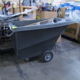 new dump bin full of new rubber boots & mop handles