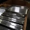 crate full of stainless pans