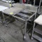 stainless table w/ space for poly cutting board, on casters