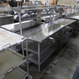 stainless table w/ 2) undershelves & upper shelf & rail support