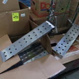 pallet of stainless meat risers, w/ Easter grass
