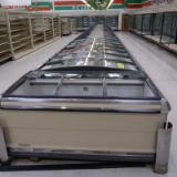 Kysor Warren double-wide coffin freezers, w/ sliding lids & hot gas defrost (12+12+12+12+8+ 2-ends)