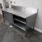stainless table w/ backsplash & cabinets under