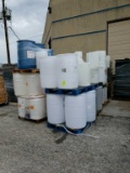 6 pallets of plastic barrels