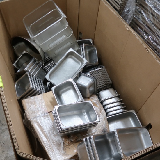 crate of stainless pans