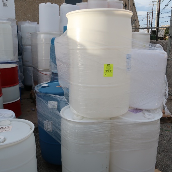 pallets of plastic barrels