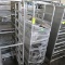 aluminum sheet pan rack filled w/ stainless pans