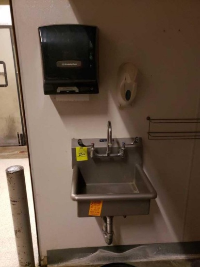Stainless hand sink with paper towel and soap