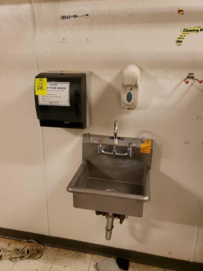 Stainless sink with paper towel and soap dispenser