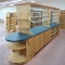 wooden shelving island, mirrored w/ glass shelves one side