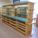 wooden shelving island, mirrored w/ glass shelves one side