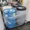 pallet of plastic barrels