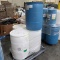 pallet of plastic barrels