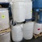 pallets of plastic barrels