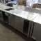 stainless table w/ cabinets under & sink on L side