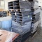 stack of black skid pallets