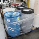 pallet of plastic barrels