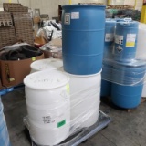 pallet of plastic barrels