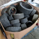 crate of used fork truck tires & rollers