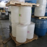 pallets of plastic barrels