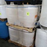 pallets of plastic barrels