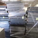 stack of black skid pallets