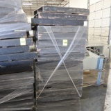 stack of black skid pallets