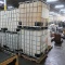 large plastic containers in steel cages