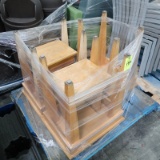 pallet of small wooden tables