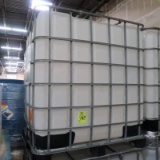 large plastic containers in steel cages