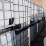 large plastic containers in steel cages