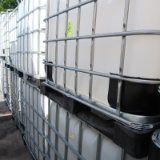 large plastic containers in steel cages